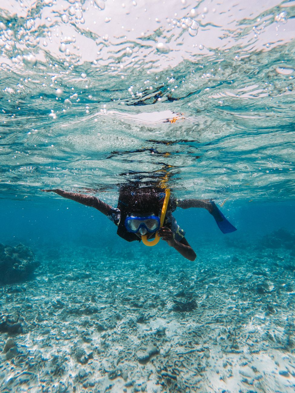 Snorkeling in the clear waters of Cala Figuera